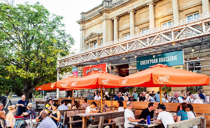Green Park Brasserie - front terrace with orange umbrellas